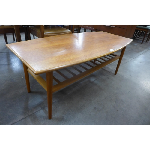 27 - A teak coffee table