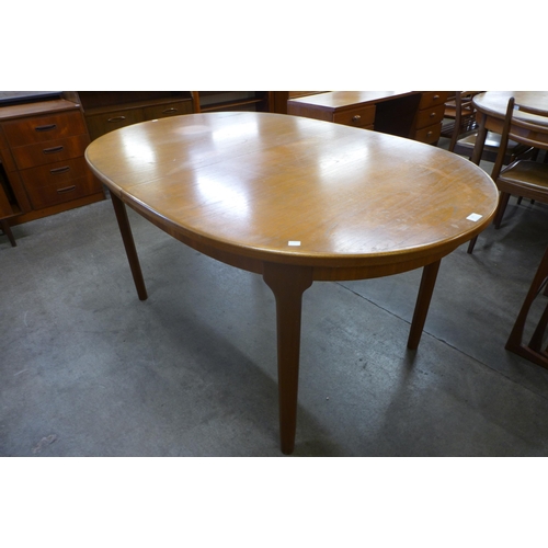 28 - A McIntosh teak extending dining table