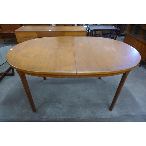 28 - A McIntosh teak extending dining table