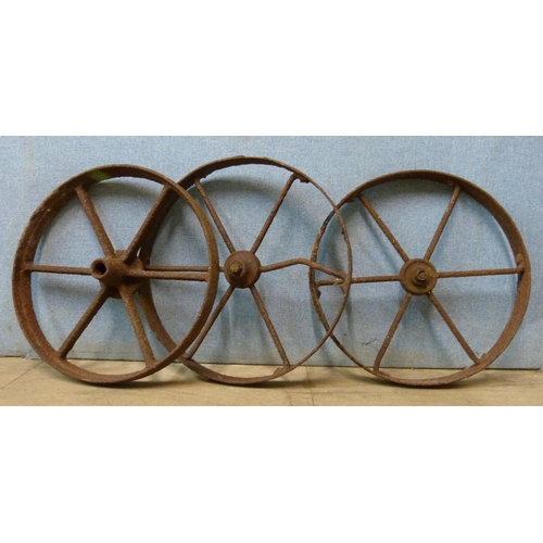 281 - A set of three cast iron agricultural wheels