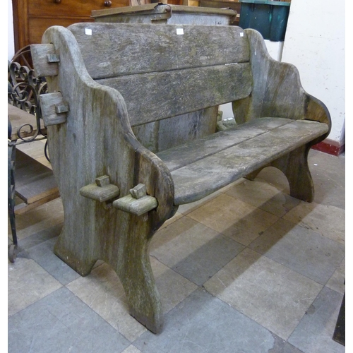 291 - A rustic hardwood garden bench