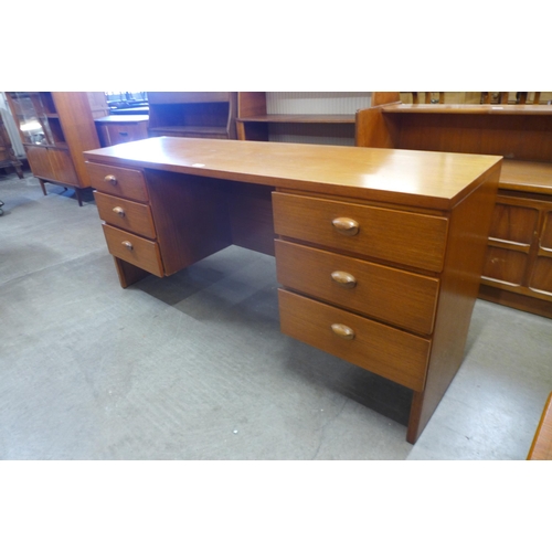 31 - An Austin Suite teak desk