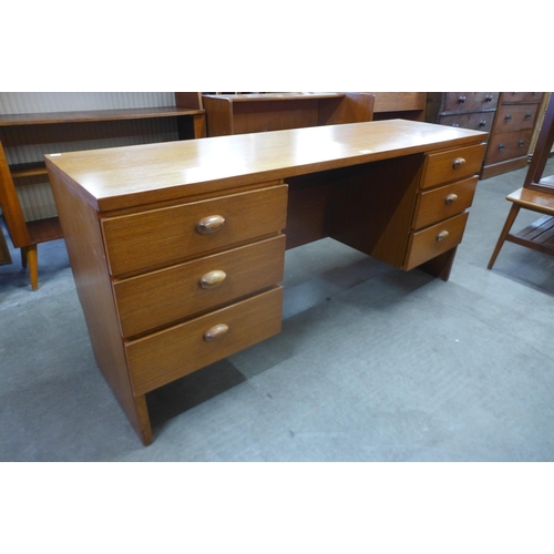 31 - An Austin Suite teak desk