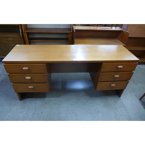 31 - An Austin Suite teak desk