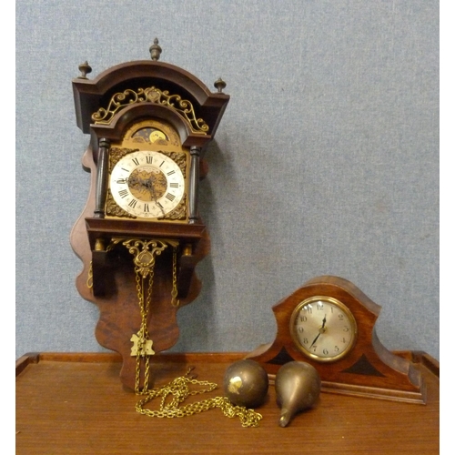 321 - A Dutch walnut wall clock and a mahogany mantel timepiece