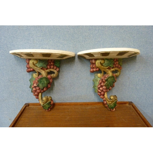 325 - A pair of Italian style painted plaster wall brackets