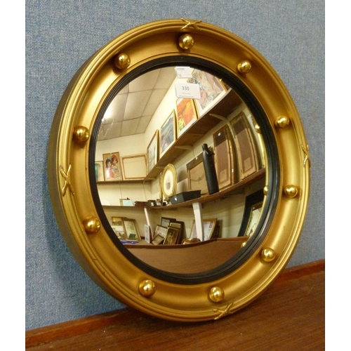 330 - A Regency style gilt framed convex mirror