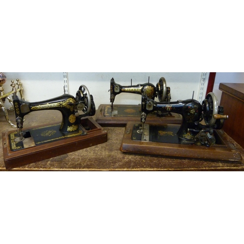 342 - Three early 20th Century cased sewing machines