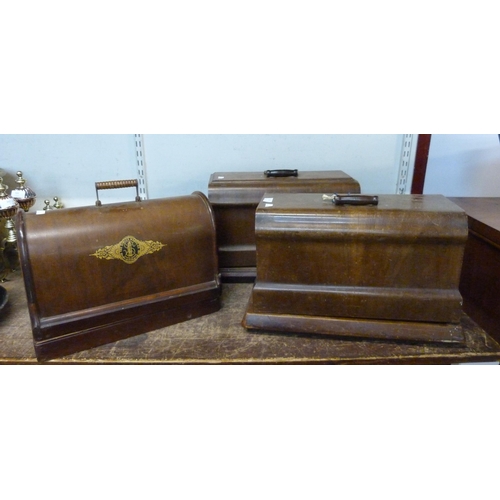 342 - Three early 20th Century cased sewing machines