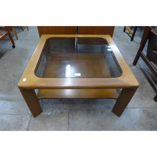 38 - A Nathan teak and glass topped square coffee table