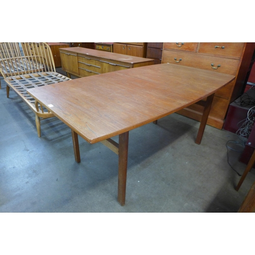 45 - A teak extending dining table