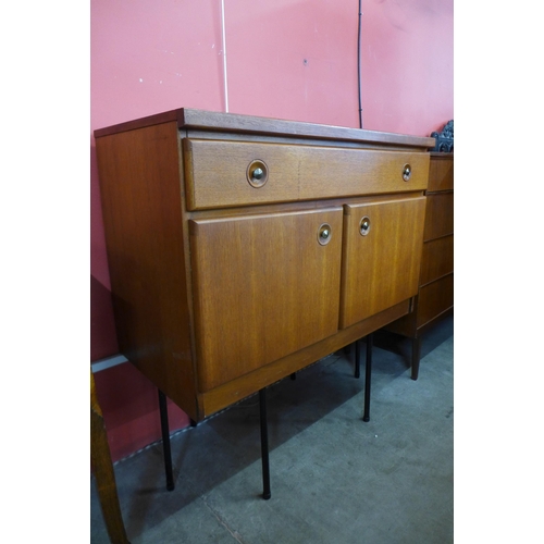 49 - A teak cabinet on black metal stand