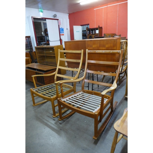 63 - A pair of Parker Knoll teak rocking chairs