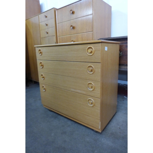 64 - A teak wall unit and a teak chest of drawers