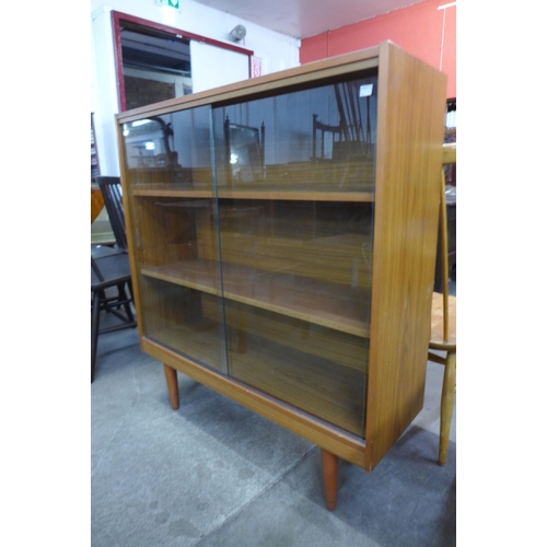 67 - A simulated teak bookcase