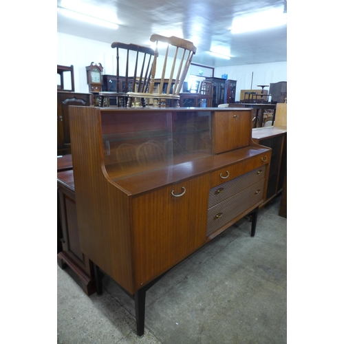 73 - A Nathan tola wood highboard