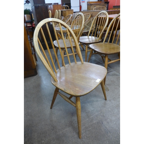 74 - A set of four Ercol Blonde elm and beech Windsor chairs