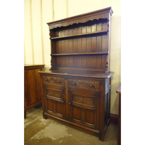 86 - A 17th Century style carved Ipswich oak dresser