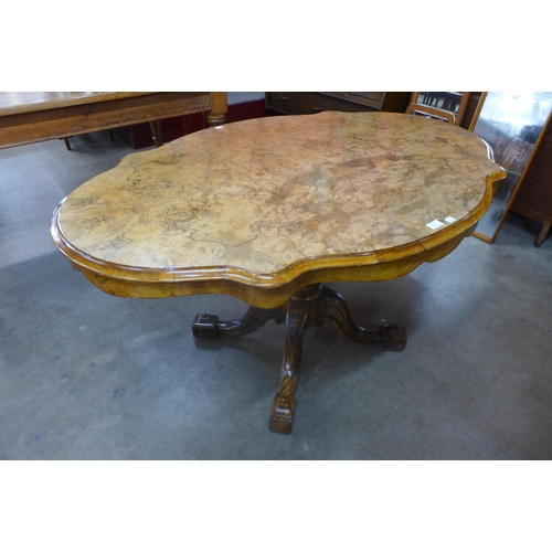 96 - A Victorian figured walnut serpentine tilt top centre table