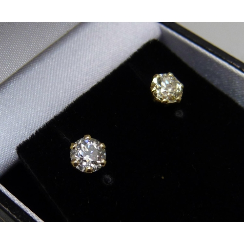 1007 - A pair of hallmarked 18ct gold and diamond stud earrings, total diamond weight 1.06ct