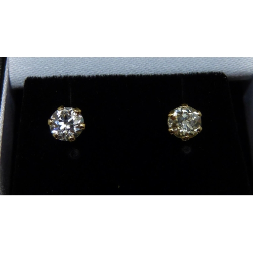 1007 - A pair of hallmarked 18ct gold and diamond stud earrings, total diamond weight 1.06ct