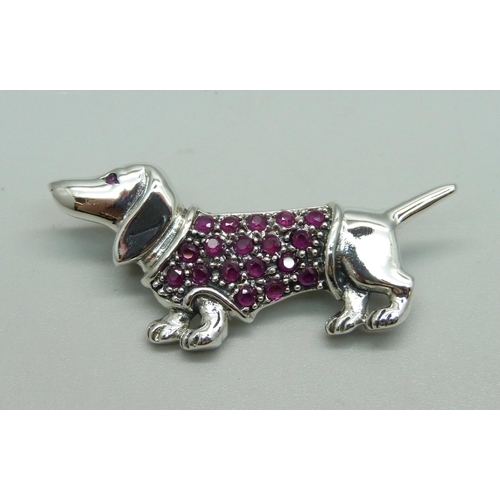 1012 - A silver and ruby Dachschund dog brooch