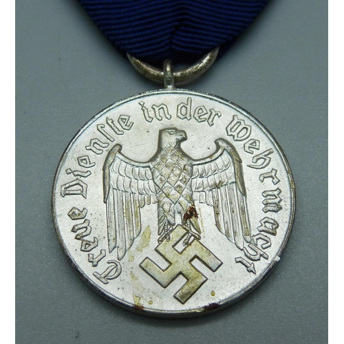 1016 - A WWII German Four Year Service medal