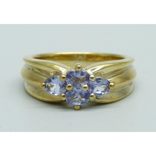 1027 - A silver gilt and tanzanite cluster ring, N