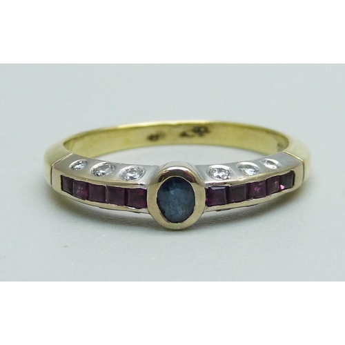 1029 - A yellow metal, sapphire and ruby ring with diamond set shank, 3.3g, N, marked 750 and 18k