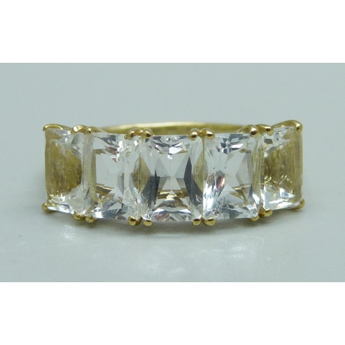 1031 - A silver gilt, five stone serenite ring, S