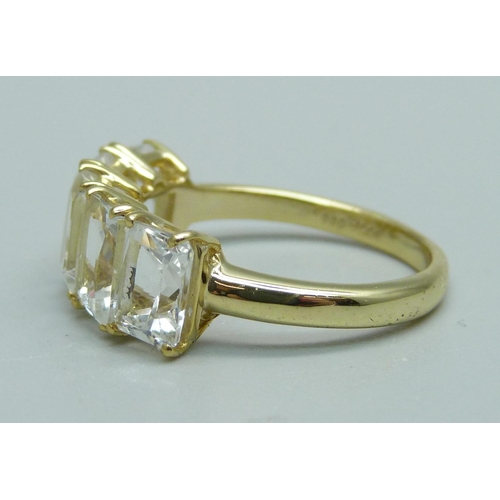 1031 - A silver gilt, five stone serenite ring, S