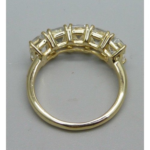 1031 - A silver gilt, five stone serenite ring, S