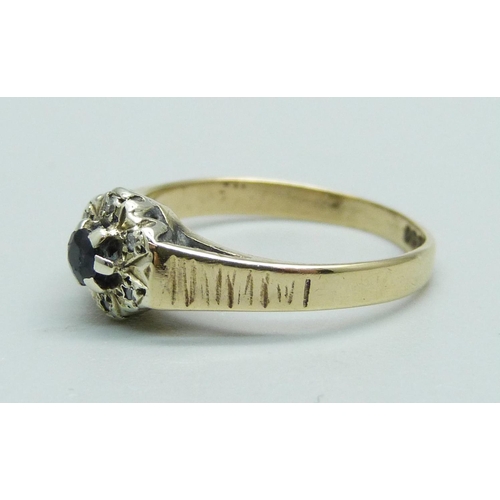 1040 - A 9ct gold, sapphire and diamond cluster ring, 2g, L