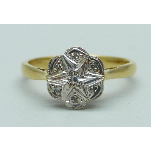 1044 - An early 20th Century 18ct gold and platinum set diamond daisy cluster ring, 2.5g, K, (mark worn)