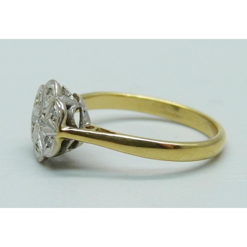 1044 - An early 20th Century 18ct gold and platinum set diamond daisy cluster ring, 2.5g, K, (mark worn)