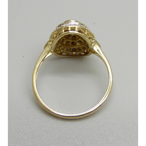 1049 - A 9ct gold and diamond cluster ring, approximately 50 stones, 3.2g, O