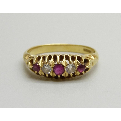 1052 - An 18ct gold, two diamond and three ruby ring, 3.3g, M