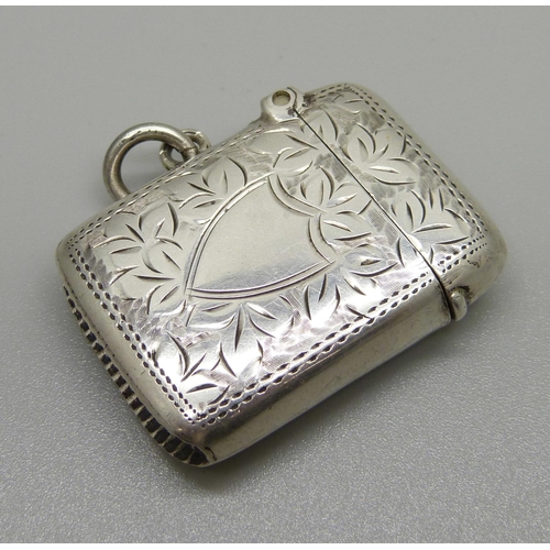 1054 - An engraved silver vesta case, Birmingham 1915