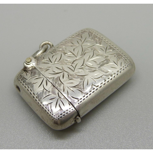 1054 - An engraved silver vesta case, Birmingham 1915