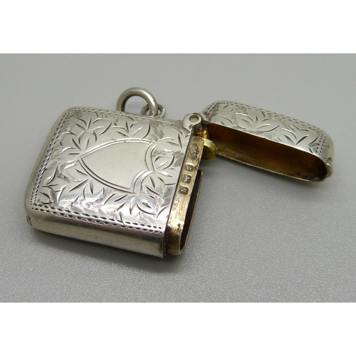 1054 - An engraved silver vesta case, Birmingham 1915