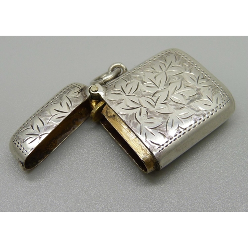 1054 - An engraved silver vesta case, Birmingham 1915