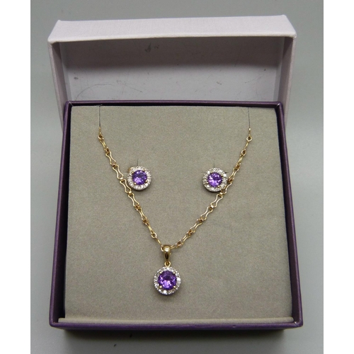 1055 - A 9ct gold, amethyst and diamond pendant on chain with matching earrings