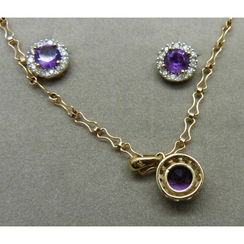 1055 - A 9ct gold, amethyst and diamond pendant on chain with matching earrings