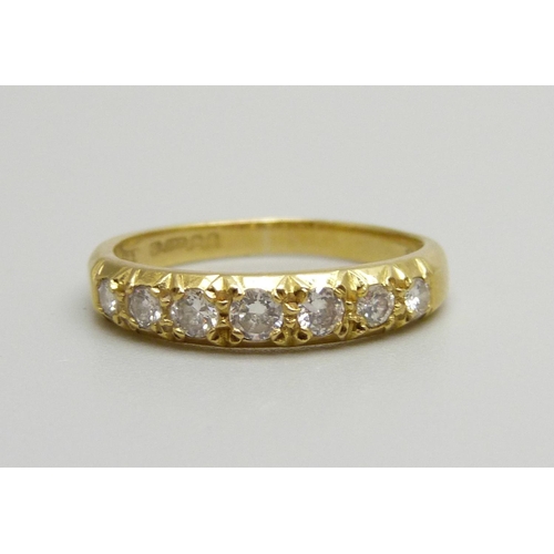 1063 - An 18ct gold, seven stone diamond ring, 2.8g, M