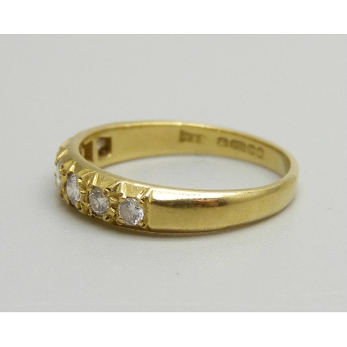 1063 - An 18ct gold, seven stone diamond ring, 2.8g, M