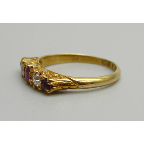 1066 - An 18ct gold, ruby and diamond ring, 2.5g, K, (one stone possibly replaced)