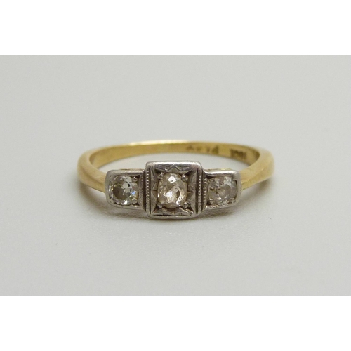 1067 - An Art Deco 18ct gold and three diamond ring, 2g, K