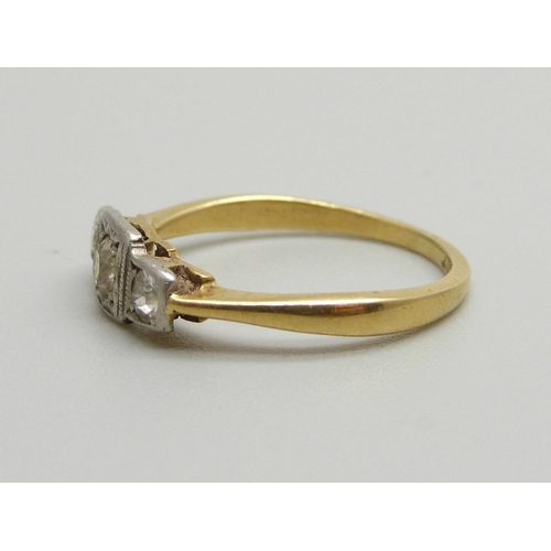 1067 - An Art Deco 18ct gold and three diamond ring, 2g, K