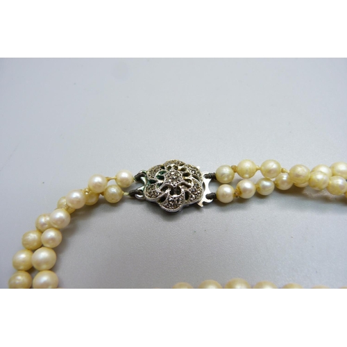 1082 - An Osaki Pearls necklace with silver and marcasite clasp, boxed