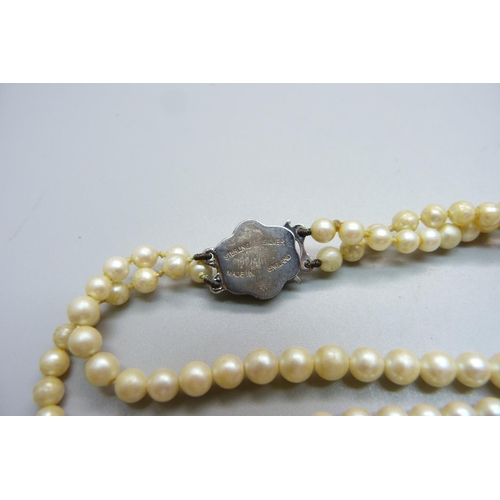 1082 - An Osaki Pearls necklace with silver and marcasite clasp, boxed